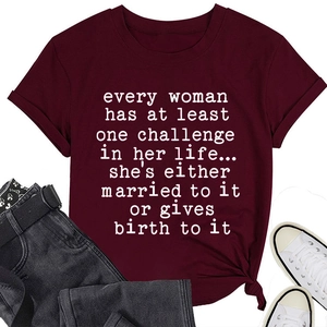Flat lay of women's burgundy cotton t-shirt with large white slogan print detail