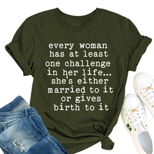 Flat lay of women's dark green loose t-shirt with humor slogan and denim jeans