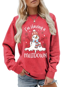 Detail of red crewneck sweatshirt with cute melting snowman graphic and funny text print