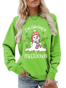 Detail of melting snowman print and Meltdown text on green crewneck sweatshirt