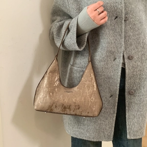 Metallic champagne gold snakeskin texture underarm bag with vertical lines