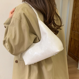 White hobo shoulder bag with snake skin texture and slim strap for daily commuting
