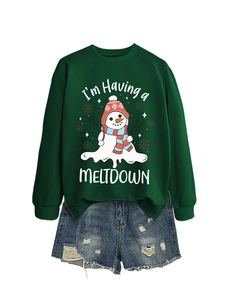 Detail of green sweatshirt with melting snowman print and distressed denim shorts