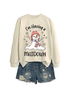 Detail of sweatshirt with snowman melting graphic and distressed denim shorts set