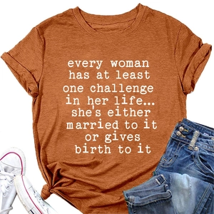 Flat lay of caramel cotton t-shirt with white graphic print and casual denim jeans