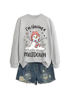 Detail of grey crewneck sweatshirt featuring a Melting Snowman graphic and denim shorts