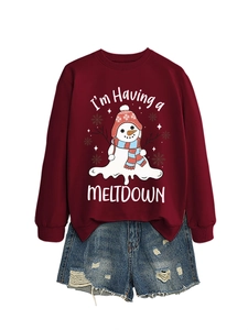 Detail of melting snowman print and 'I'm Having a MELTDOWN' text on burgundy sweatshirt