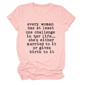 Close-up of pink cotton T-shirt featuring black slogan print and folded sleeve detail