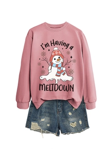 Detail of pink sweatshirt featuring a melting snowman print and distressed denim shorts