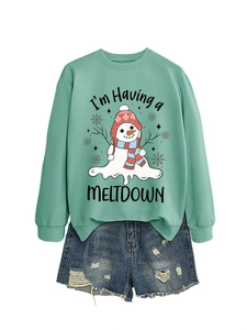 Detail of mint green sweatshirt with melting snowman print and fun text on fabric