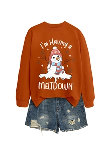 Close-up of melting snowman print on burnt orange sweatshirt with Meltdown text detail