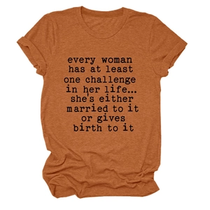 Close-up of rust-red cotton t-shirt fabric texture and minimalist quote print