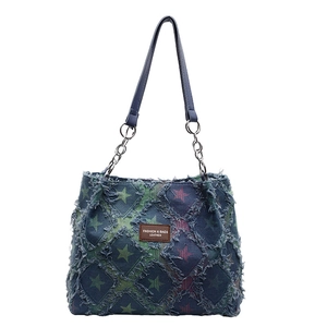 Retro distressed denim tote bag with star print, tassel trim and leather handles