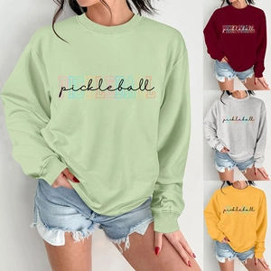Detailed collage of women's pickleball sweatshirts in green, red, grey and yellow