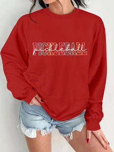 Close-up of a red round neck long sleeve sweatshirt featuring a colorful Pickleball print