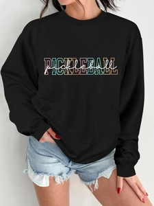Detail of black long-sleeve sweatshirt with colorful Pickleball print and soft fabric texture