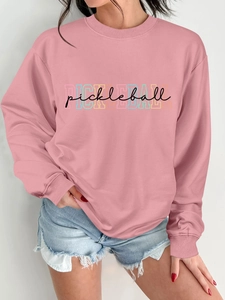 Detail of pink crewneck sweatshirt with colorful Pickleball layered graphic print
