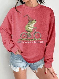 Détail du sweat-shirt rouge rouille avec imprimé grenouille drôle et texte kerfuffle