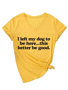 Detail of V-neck cotton T-shirt with rolled sleeves and creative side knot in ginger yellow