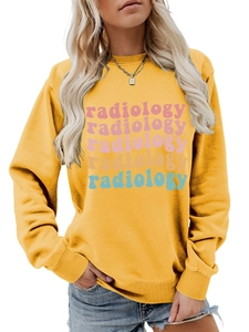 Macro detail of the colorful radiology print on a casual ginger crewneck sweatshirt
