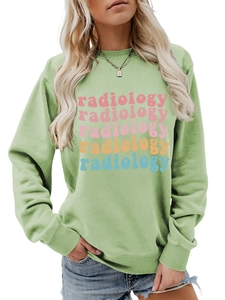 Detail of light green sweatshirt featuring colorful radiology text print on the chest