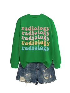 Flat lay of green radiology print sweatshirt paired with distressed denim shorts