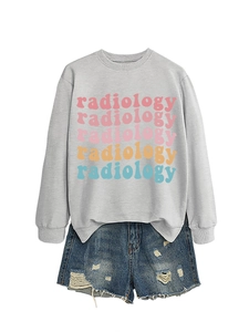 Detail of colorful radiology text print on grey sweatshirt and distressed denim shorts