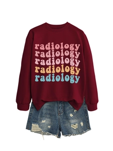 Detail of radiology letter print on maroon crewneck sweatshirt with distressed denim shorts