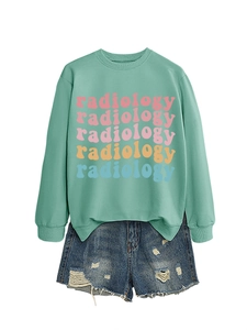Detail view of radiology lettering in pastel colors on mint green crewneck sweatshirt