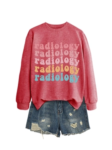 Flat lay of red long sleeve radiology sweatshirt with colorful text and ripped denim shorts