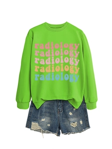 Detail view of radiology colorful print on green sweatshirt with denim shorts set
