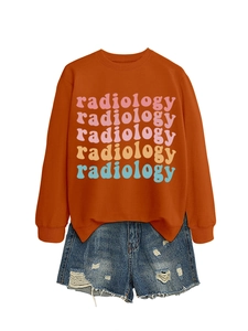 Detail of colorful radiology print on orange long sleeve sweatshirt and denim shorts