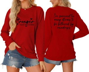 Front and back view of red crewneck sweatshirt with Stronger THAN THE STORM letter print
