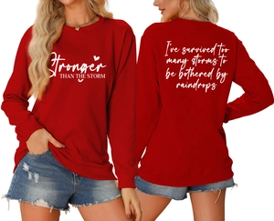 Detailed front and back view of red crewneck sweatshirt with white motivational quotes