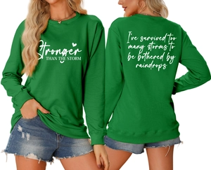 Front and back view of green crewneck sweatshirt with white letter print and heart graphic