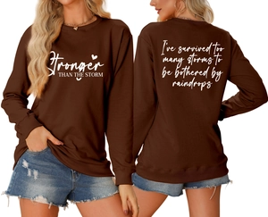 Front and back view of brown crewneck sweatshirt with white inspirational typography