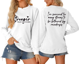 Front and back view of white casual sweatshirt with Stronger Than The Storm print detail