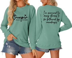Detailed front and back view of bean green sweatshirt with storm quote and heart print