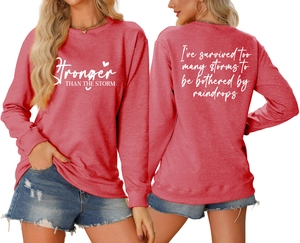 Detailed front and back view of coral pink sweatshirt with motivational typography print