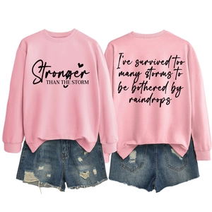 Front and back view of pink long sleeve sweatshirt with inspirational quote print