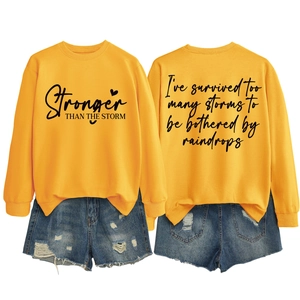 Front and back view of yellow sweatshirt with I've survived too many storms print design
