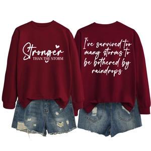 Front and back view of burgundy letter print sweatshirt with distressed denim shorts