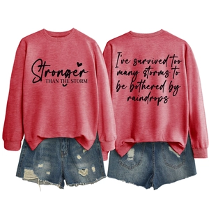 Front and back view of red crewneck sweatshirt with inspirational quotes and denim shorts