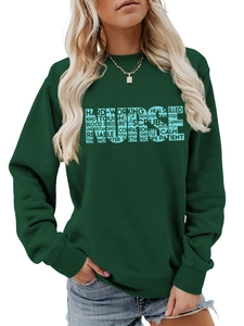 Detail of teal crewneck sweatshirt with blue NURSE stethoscope graphic and typography