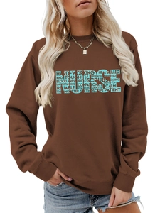 Close-up of the light blue NURSE typography and stethoscope print on brown sweatshirt