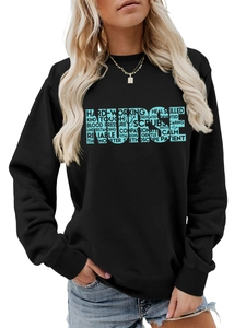 Detail of blue NURSE typography and stethoscope graphic on black crewneck sweatshirt