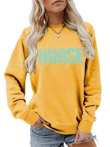 Close-up of yellow nurse sweatshirt featuring blue letter art and stethoscope design