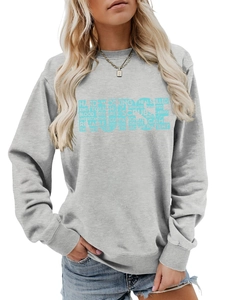 Detail of light grey nurse sweatshirt featuring a medical word cloud print and stethoscope graphic