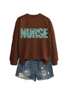 Detail of NURSE letter graphic with stethoscope motifs on a brown sweatshirt