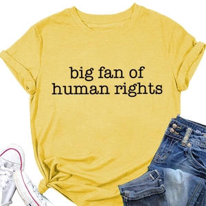 Detail of yellow crewneck t-shirt featuring 'big fan of human rights' slogan print